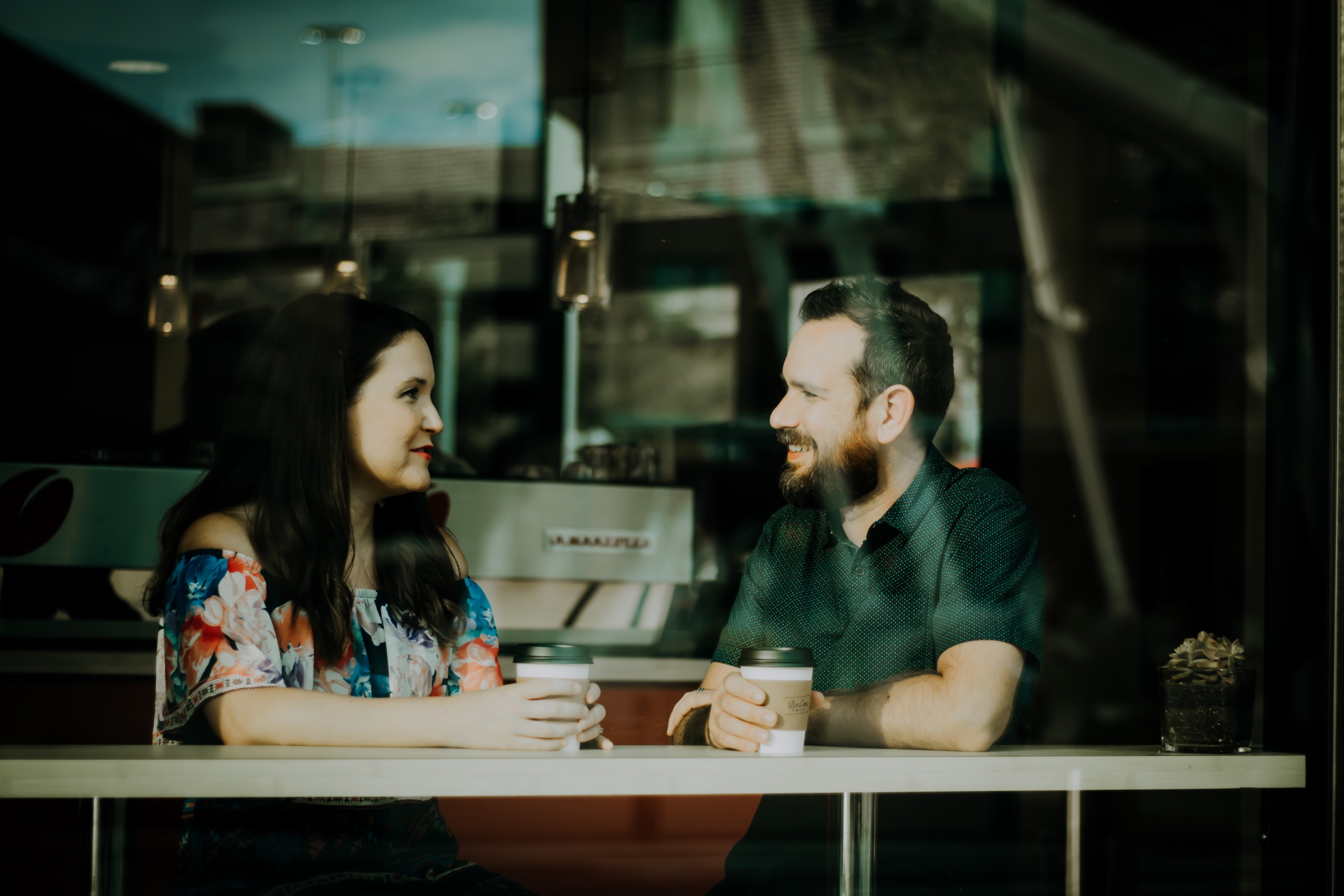 couple talking at cafe