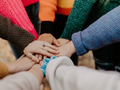 team huddle in addiction counseling group