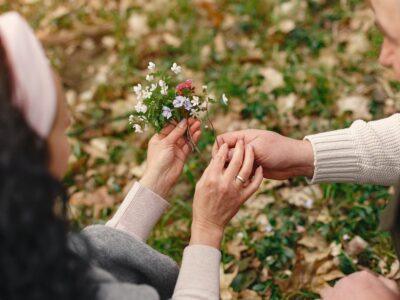 Husband giving wife wildflowers